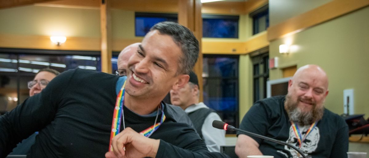 Members smile at the pride conference
