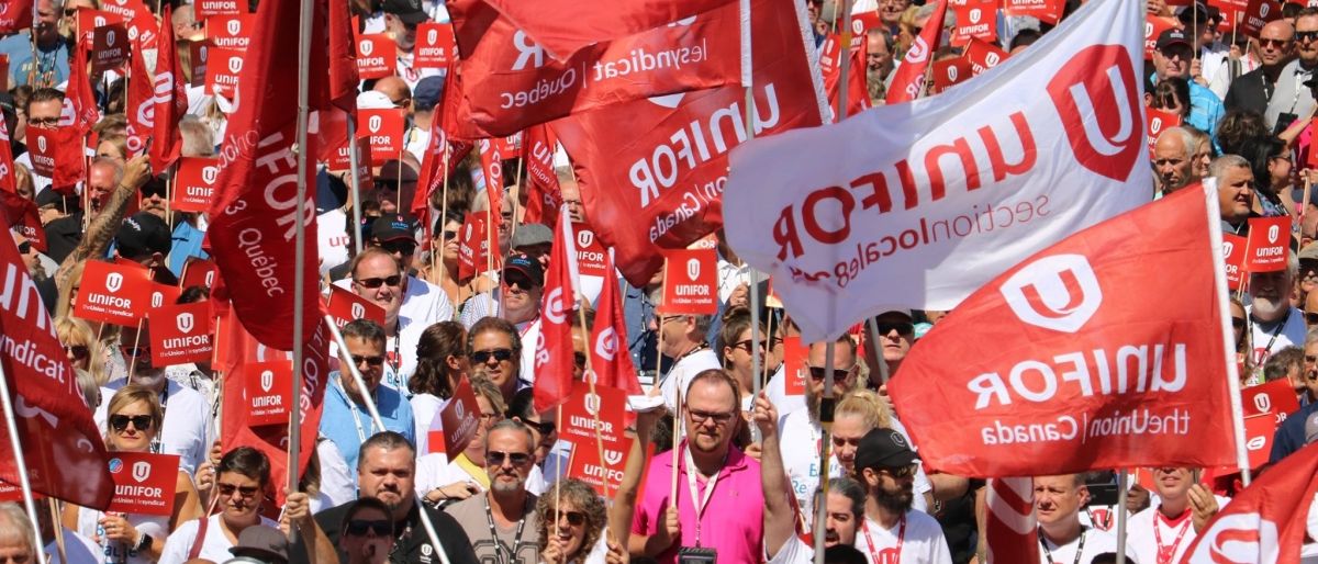 Unifor members take part in a large rally.