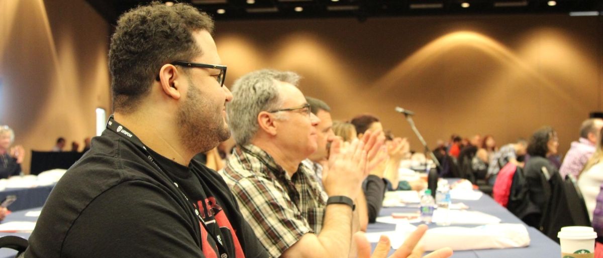 Delegates to Prairie Regional Council seated in a hotel ballroom.