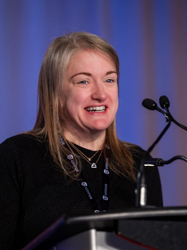A women at a podium mic