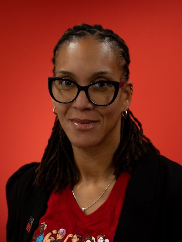 A women's headshot on a red background