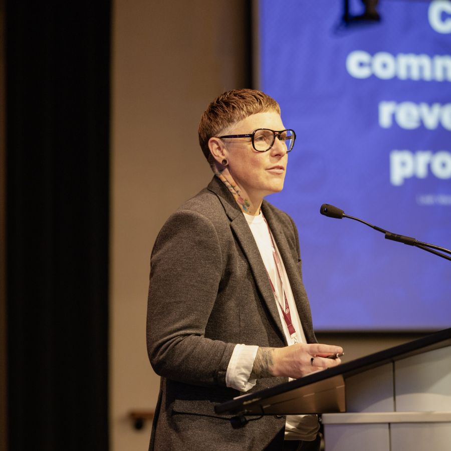 A women speaking at a podium