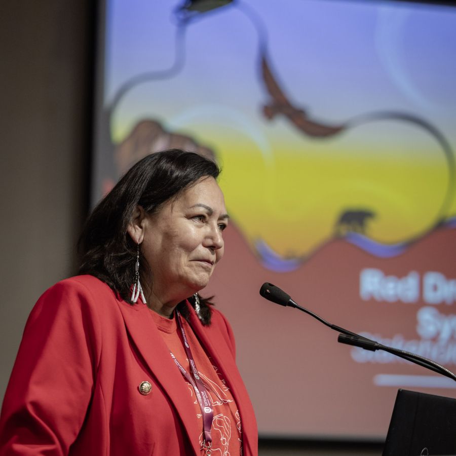 A women speaking at a podium