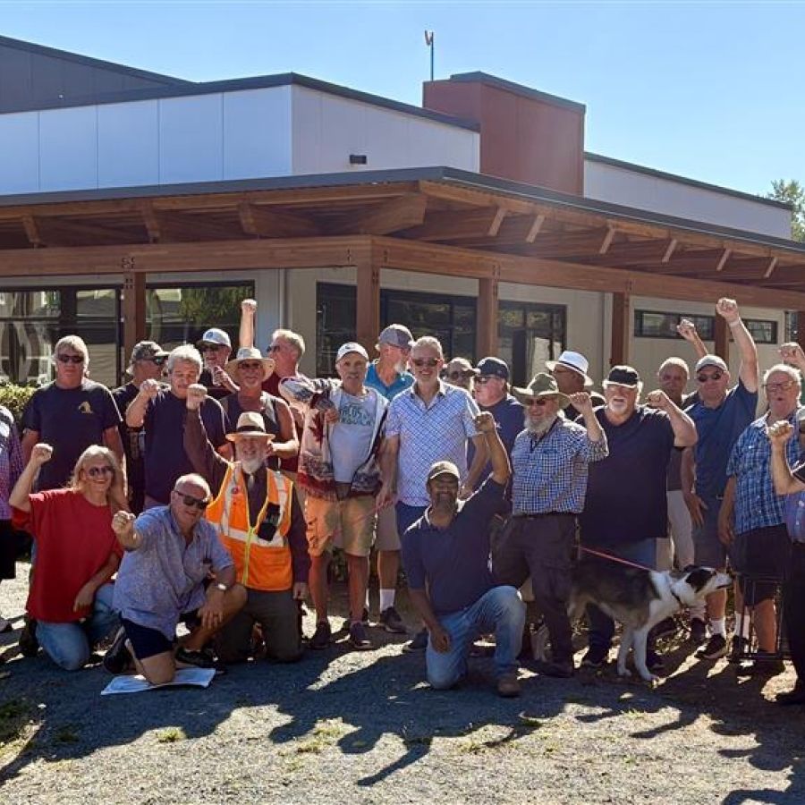   a large group outside fists raised