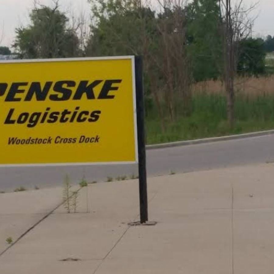 Penske Logistics exterior sign yellow with black writing